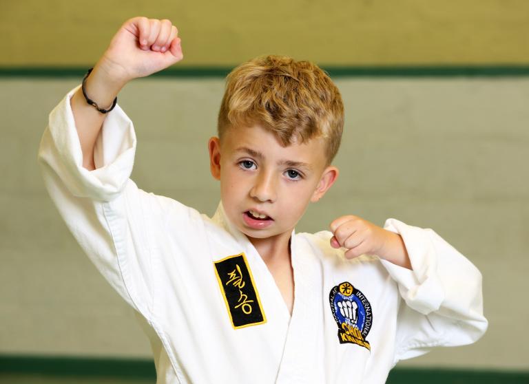 Young boy in judo pose