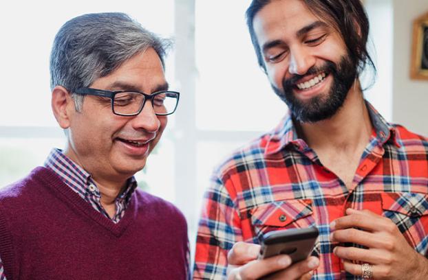 image of two males talking
